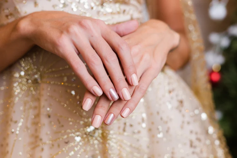 female-hands-with-christmas-new-year-nail-design-nude-beige-nail-polish-manicure